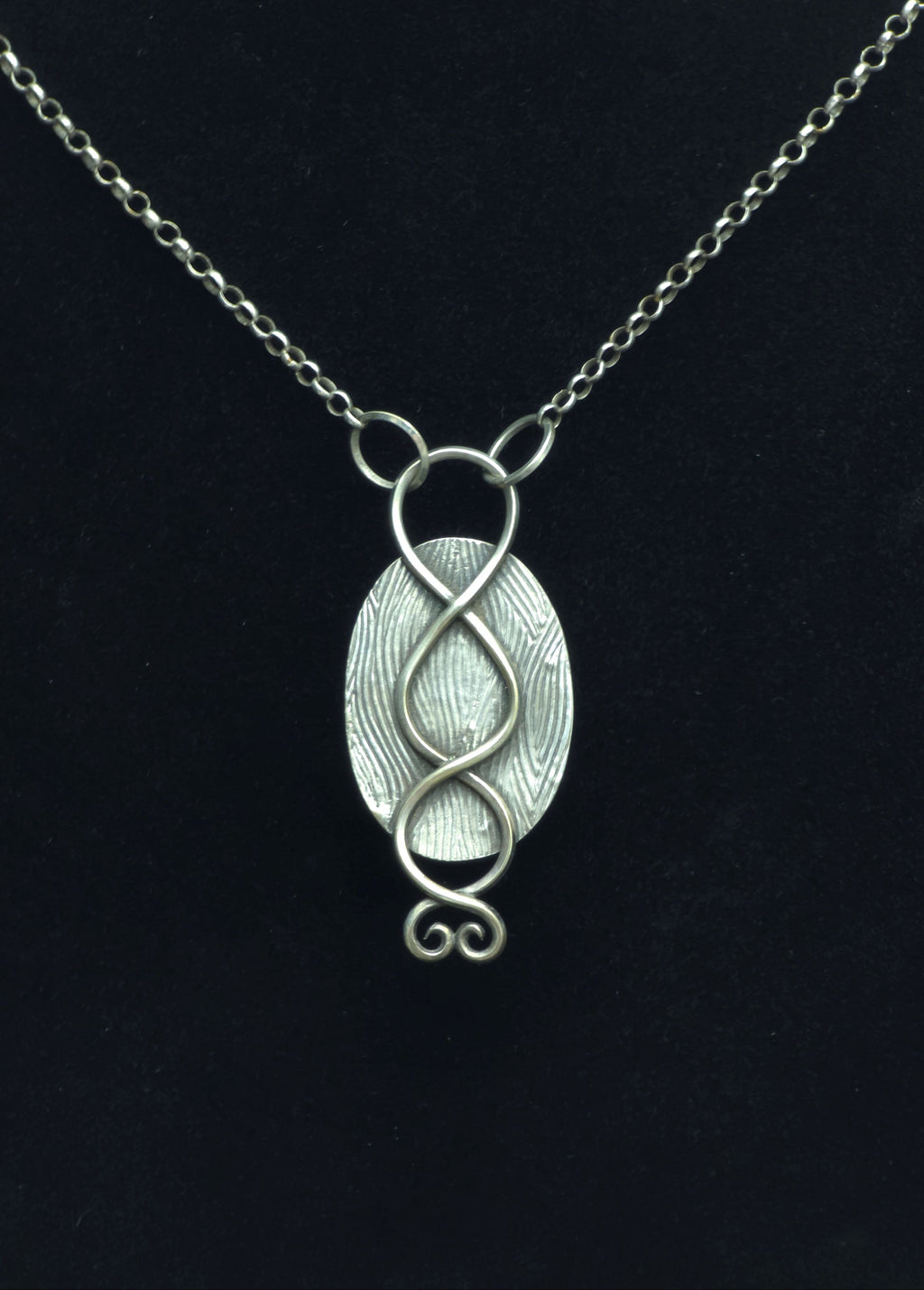 Pendant of red plume agate set in sterling silver