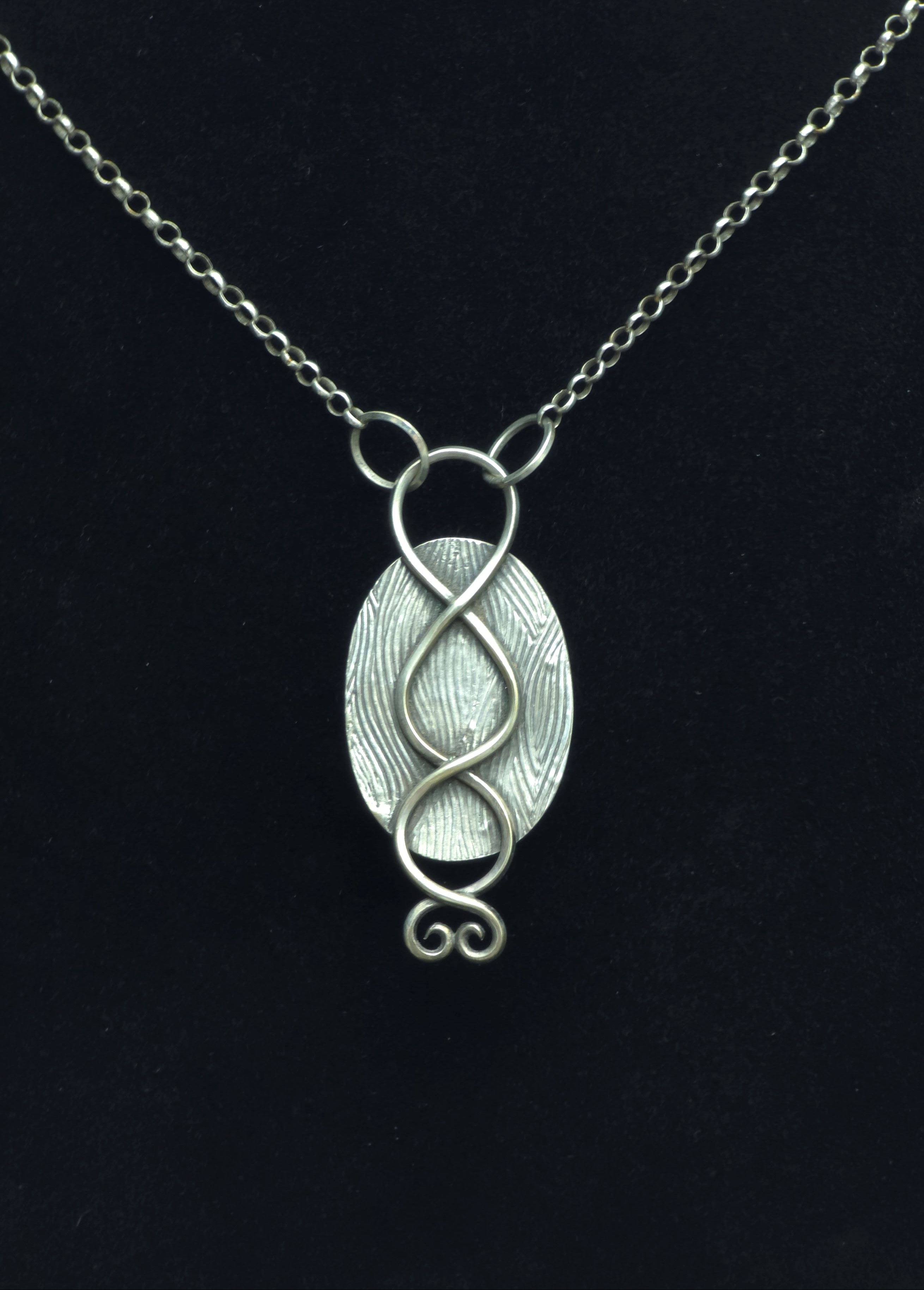 Pendant of red plume agate set in sterling silver