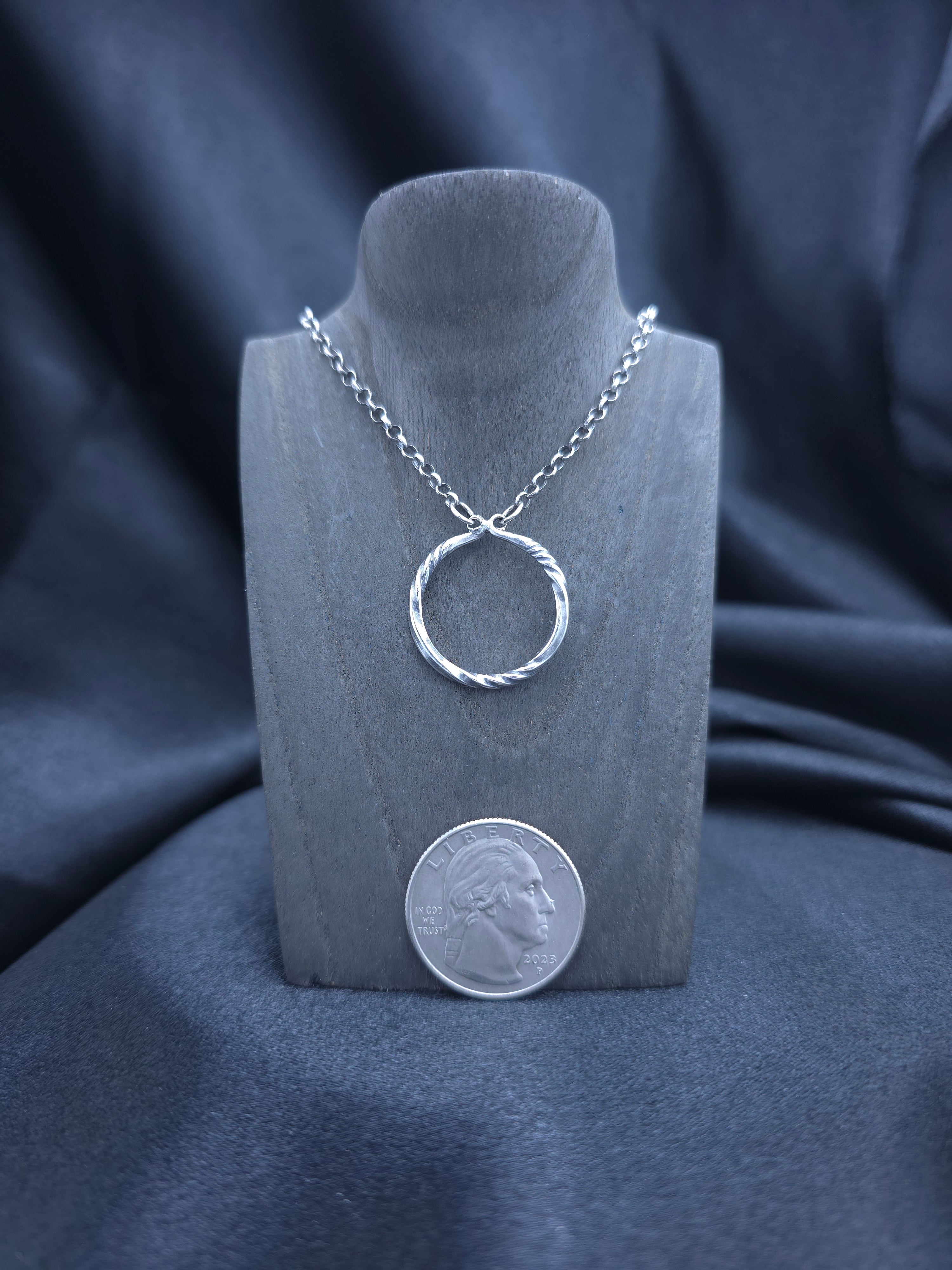 Simply twisted sterling silver pendant