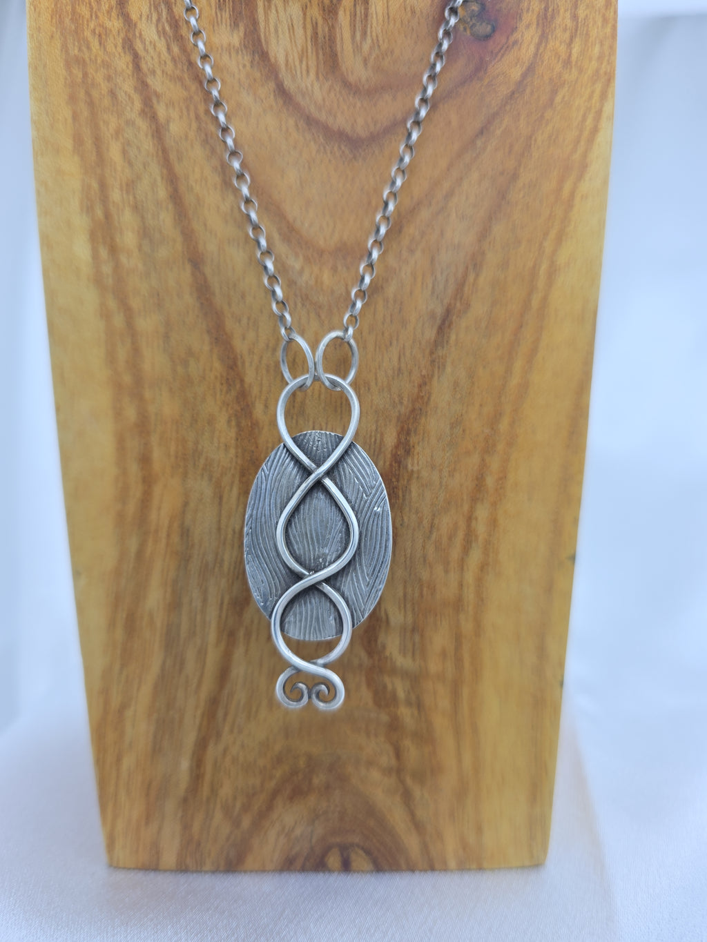 Pendant of red plume agate set in sterling silver