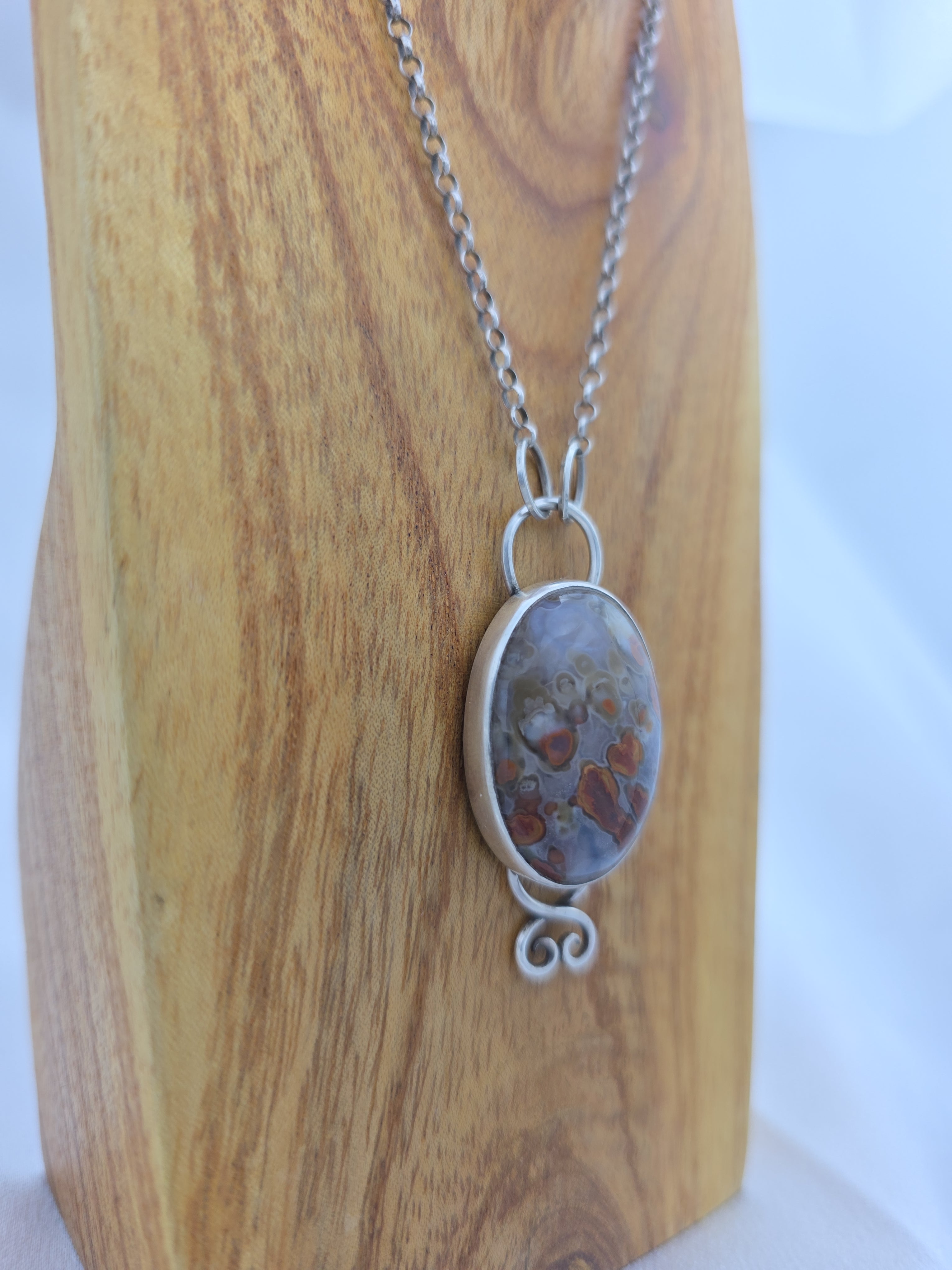 Pendant of red plume agate set in sterling silver